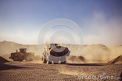 Bull Dozers and front loaders in work site Stock Photo