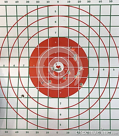 Bull eye target with bullet hole. Stock Photo