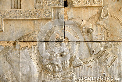 Bull and a lion at the ruins of Persepolis in Iran Editorial Stock Photo