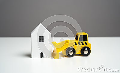 Bulldozer demolishes house, concept. Illegal buildings construction. Stock Photo