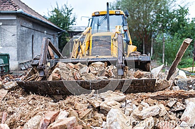 Bulldozer demolishing an old building Stock Photo