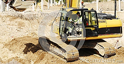 Bulldozer and driver in action Stock Photo