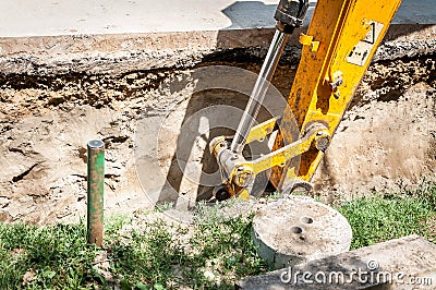 Bulldozer excavator machinery excavate and prepare to loading ground to tipper truck on the street reconstruction site of district Stock Photo