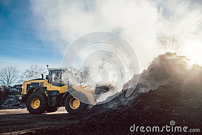 Bulldozer at heavy earthworks in biomass facility Stock Photo