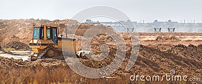 Bulldozer heavy machinery transport raking clay. Stock Photo