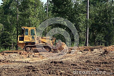 Bulldozer pushing sand Stock Photo