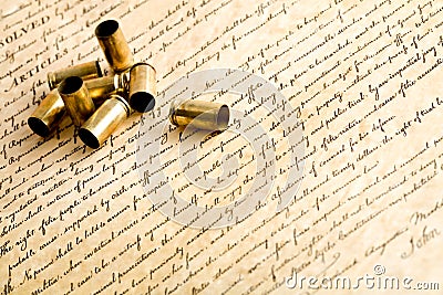 Bullet casings on bill of rights Stock Photo