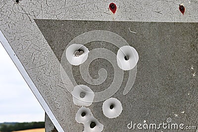Bullet holes in a german traffic sign from a gun shooting exercise Stock Photo