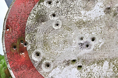 Bullet holes in a german traffic sign from a gun shooting exercise Stock Photo