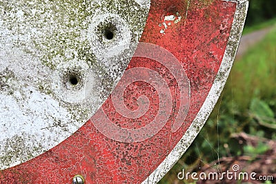 Bullet holes in a german traffic sign from a gun shooting exercise Stock Photo