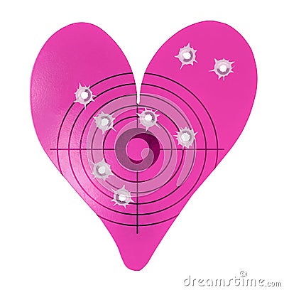 Bulletholes in a metal heart-shaped target Stock Photo