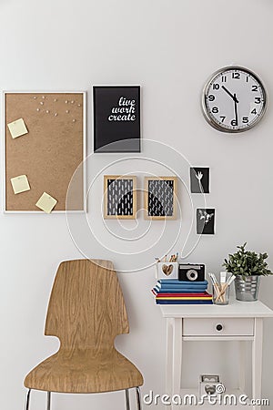 Bulletin board and wooden chair Stock Photo