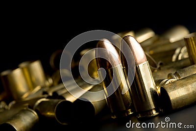 Bullets on black Stock Photo