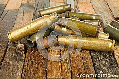 Bullets shell on wooden background. Stock Photo