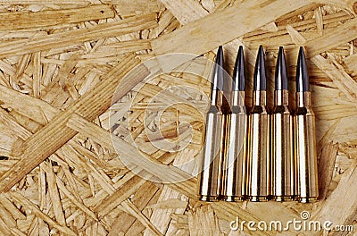 Bullets on wooden texture Stock Photo