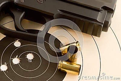 Bullseye target and gun Stock Photo