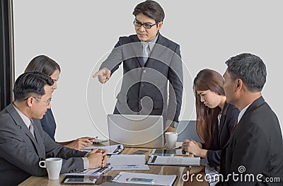 Bullying with an out of control boss shouting to a stressed employee at office Stock Photo