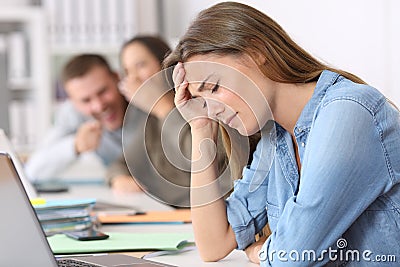 Bullying victim being criticized at office Stock Photo