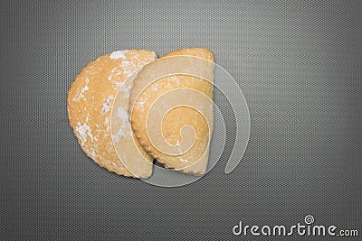 Bun with cottage cheese. Studio image. Homemade cakes with cottage cheese on a gray background. Stock Photo