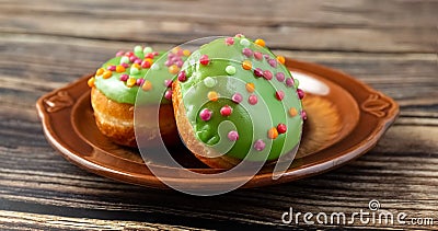 Bun, donut covered with glaze. Tutti frutti bun on a plate. Sweet pastries. Dessert. Copy space. Close-up Stock Photo