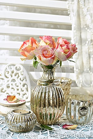 Bunch of multicolor roses in shabby chic style interior Stock Photo