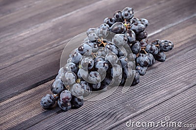 Bunch of black grapes on the table still life Stock Photo