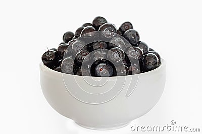 Bunch blueberries berries with ceramic light mug isolated on white background Stock Photo