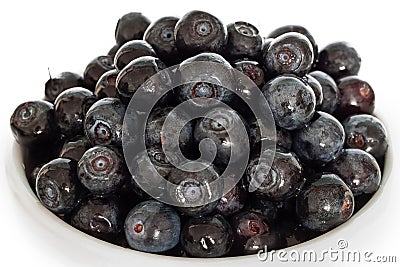 Bunch blueberries berries with ceramic light mug isolated on white background macro Stock Photo