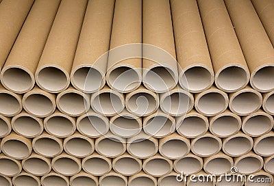 A bunch of brown industrial paper core. A lot of paper cores or paper tubes. Stock Photo