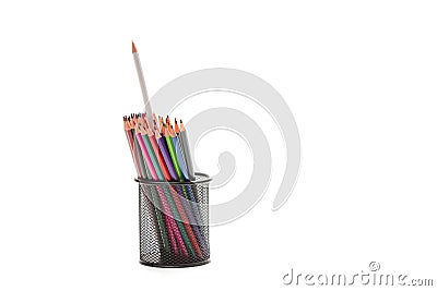 Bunch of Colored Wooden Pencils Placed Together in Metal Round Holder. With One Standout Pencil. Isolated Over White Stock Photo