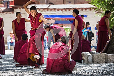 A bunch of debating Tibetan Buddhist monks at Sera Monastery Editorial Stock Photo