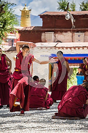 A bunch of debating Tibetan Buddhist monks at Sera Monastery Editorial Stock Photo