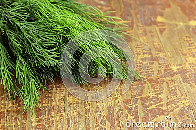 Bunch of dill on wooden background Stock Photo