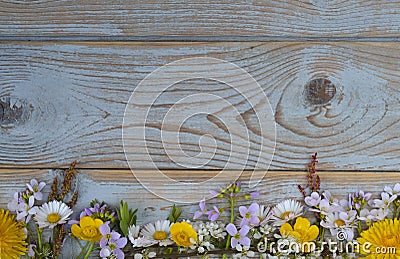 Bunch of fieldflowers,daisies, buttercups, Pentecostal flowers, dandelions on a oldwooden background with empty copy space Stock Photo