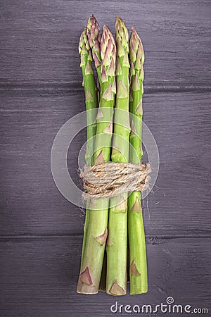 Bunch of fresh asparagus on wooden background. Stock Photo