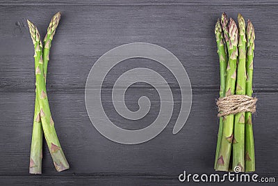 Bunch of fresh asparagus on wooden rustic background. Copy space Stock Photo