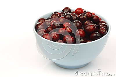 Bunch of fresh cranberries in a blue bowl Stock Photo