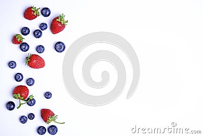 Bunch of fresh organic mixed berries, blueberry & strawberry in seamless pattern, white background. Clean eating concept. Healthy Stock Photo