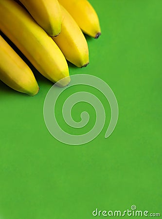 Bunch of fresh ripe bananas on green background Stock Photo