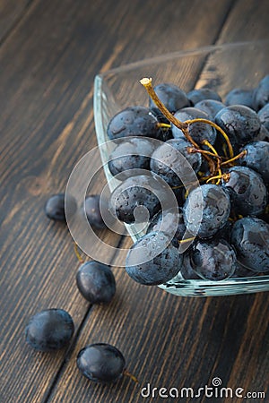 A bunch of grapes - black Spanish grape - in a glass bowl Stock Photo