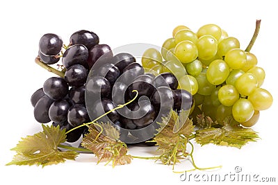 Bunch of green and blue grape with leaves isolated on white background Stock Photo