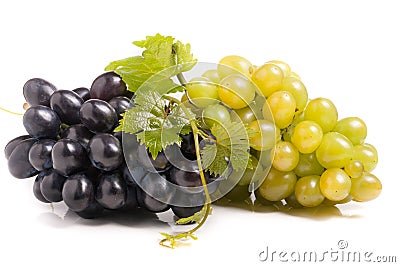 Bunch of green and blue grape with leaves isolated on white background Stock Photo