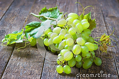 Bunch green grapes on wooden background food closeup Stock Photo