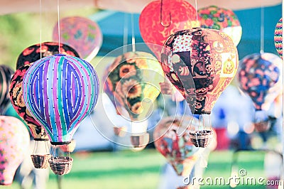 Bunch of hot air balloon toys dangling in the wind Stock Photo