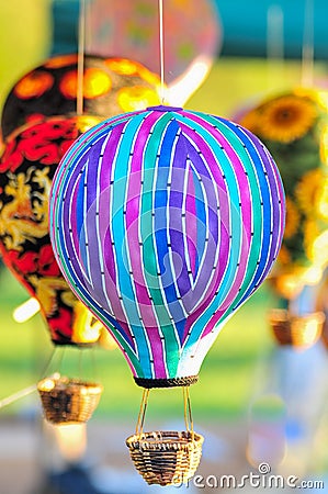 Bunch of hot air balloon toys dangling in the wind Stock Photo