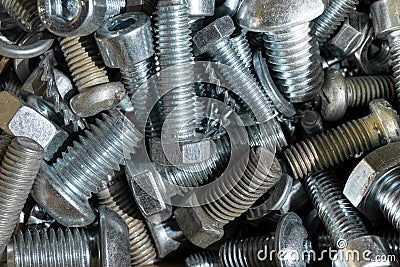 A bunch of large and small bolts with different heads. Stock Photo