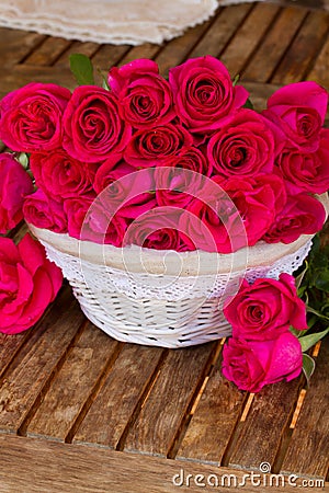 Bunch of mauve roses in basket Stock Photo