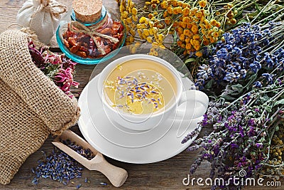 Bunch of medicinal herbs, healthy tea and bag of dry herbs. Stock Photo