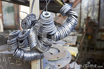 bunch of metal spacers in the workshop Stock Photo
