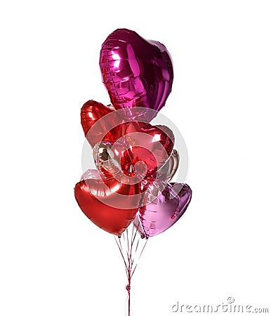 Bunch of metallic red pink heart balloons composition objects for birthday or valentines party isolated on a white Stock Photo